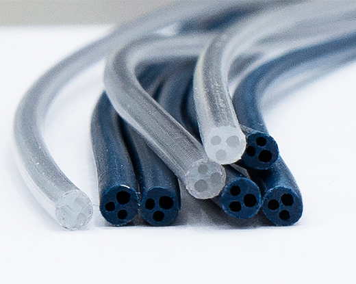 Multi-cavity extruded braided tube